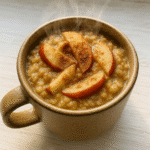 Apple pie oatmeal in a mug served hot with cinnamon