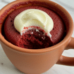 Red velvet mug cake recipe featured image showing finished cake in ceramic mug